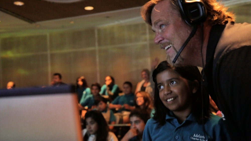 UCSB&#039;s Scott Simon with student from Adelante Charter School