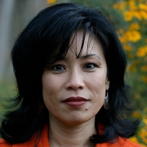 Diane Fujino wears a red top outside