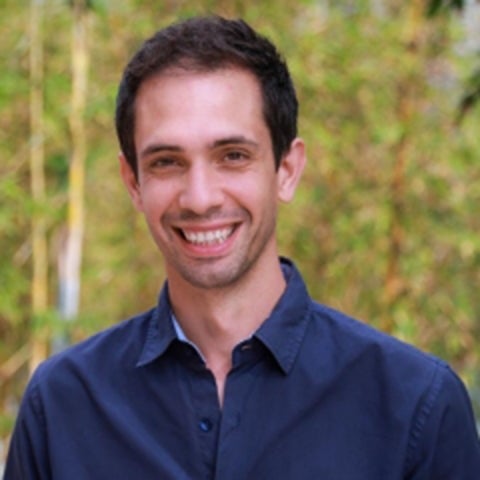 Otger Campas wears a blue shirt outdoors