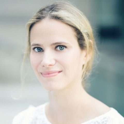 Emily Jacobs in white shirt looking at camera